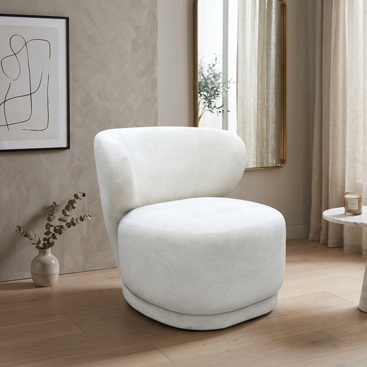 Living Room DFS ‘Kalista’ contemporary accent armchair, elegantly upholstered in premium, ultra-soft cream Palmero plain velvet fabric.