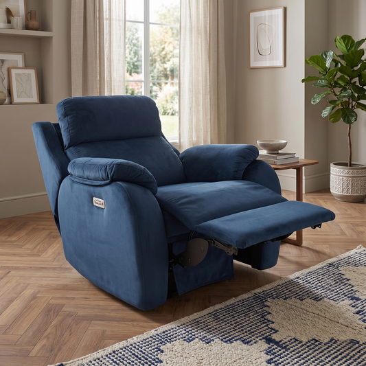 Living room view for the Kingsbury power recliner armchair, highlighting the premium navy blue velvet fabric, power headrest, and power lumbar support.