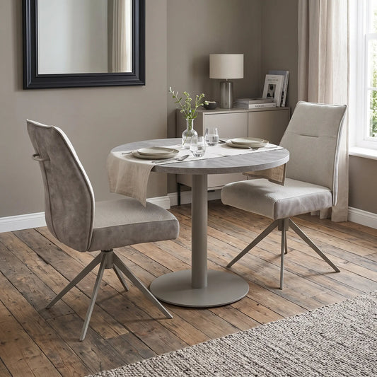 Styled upscale contemporary dining room lifestyle layout featuring the pair of Mirage neutral fabric swivel chairs beautifully arranged at a modern wooden dinner table.