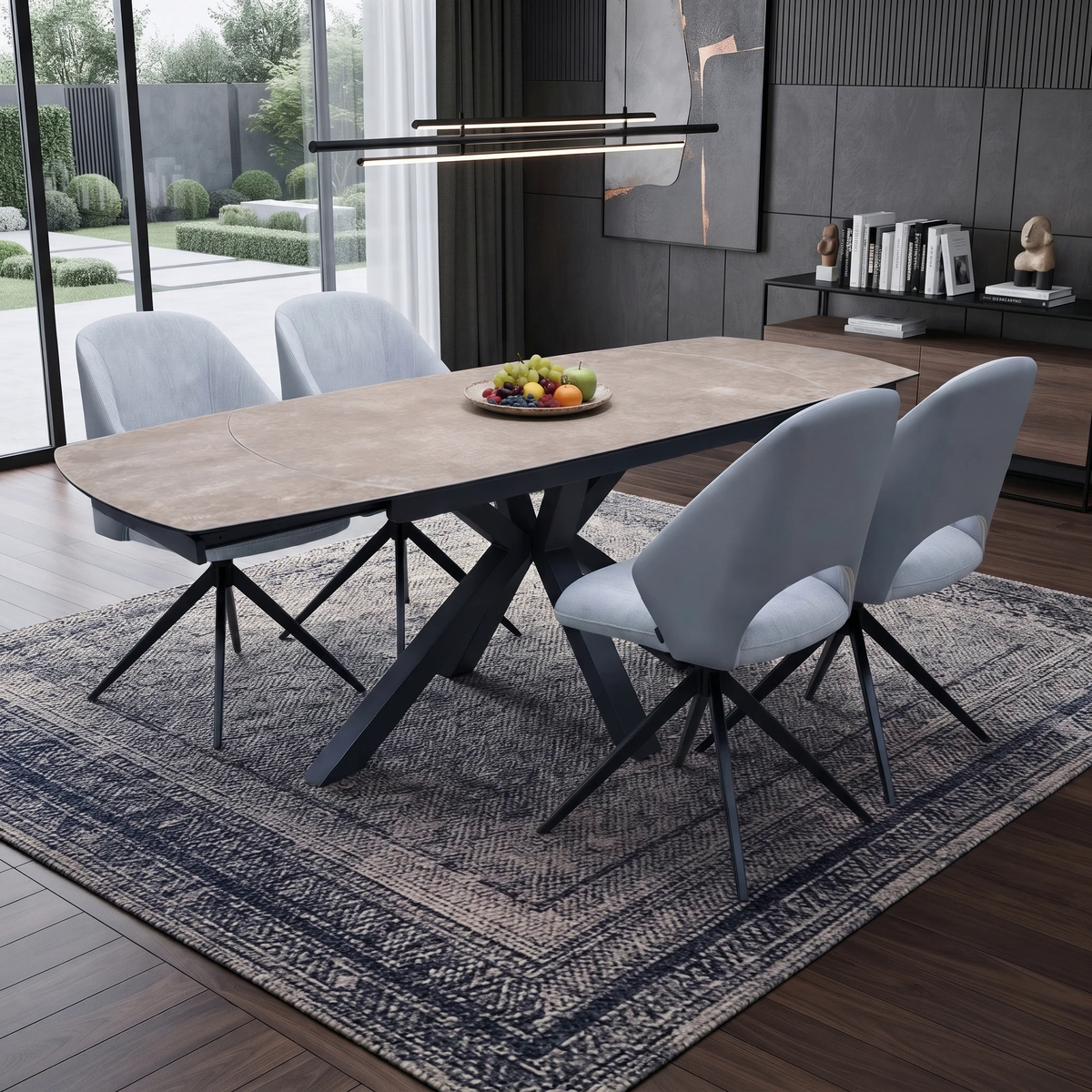 Raul argile ceramic top dining table and 4 grey swivel chairs in a dining room on a patterned rug