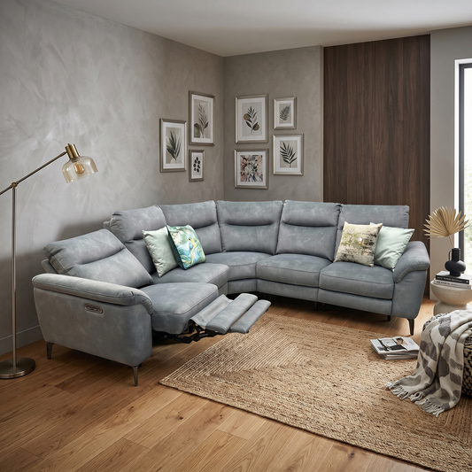 Living room view of the power recliner section of the Morgan moss green fabric corner sofa fully extended, demonstrating the smooth motorized footrest operation for premium lounging.