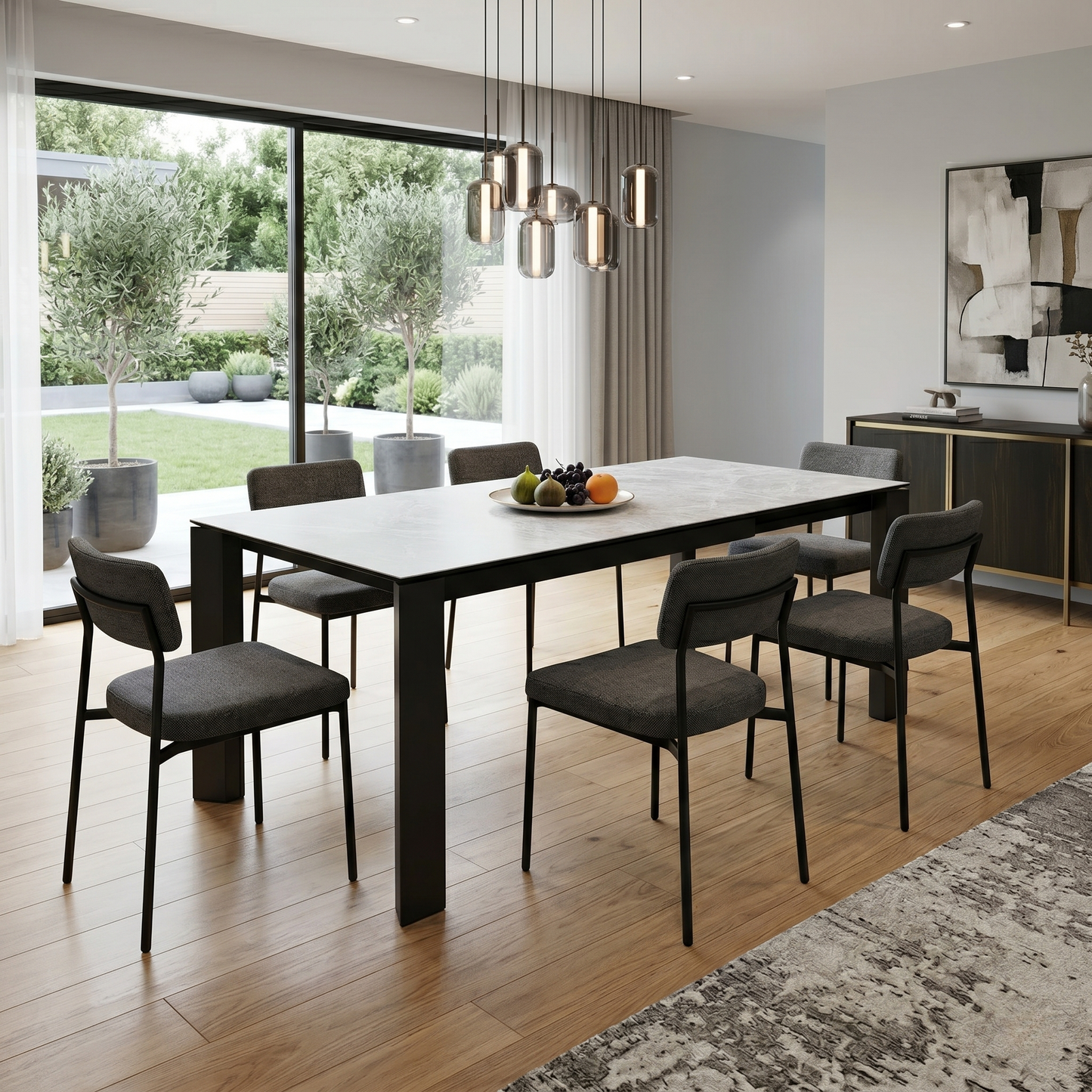 Styled luxury contemporary dining room lifestyle layout featuring the Connubia Viola ceramic extending dining table elegantly set with matching minimalist dining chairs.