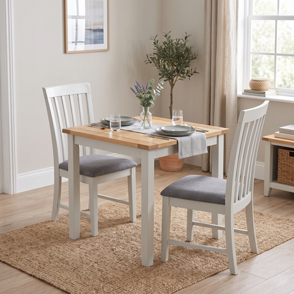 Styled upscale dining room or breakfast kitchen lifestyle layout featuring the set of 2 Hamilton high-back wooden chairs neatly arranged around a contemporary dining table.