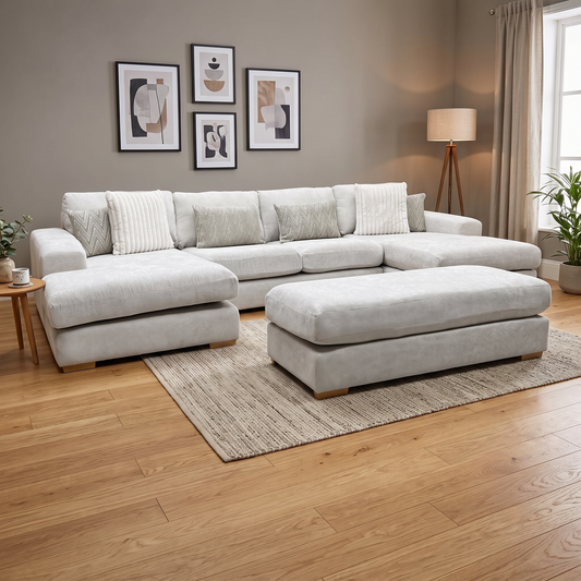 Styled upscale grand living room lifestyle layout featuring the complete Broadgate Stone fabric U-shape modular sofa and footstool arranged as an inviting, luxury home theater and family lounge center.
