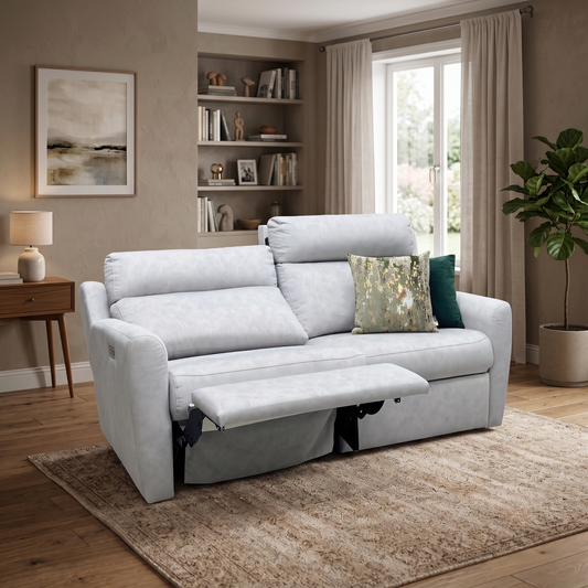 Styled upscale contemporary living room lifestyle layout featuring the G Plan Wren charcoal grey fabric power recliner sofa arranged as a luxurious, cozy family lounge centerpiece.