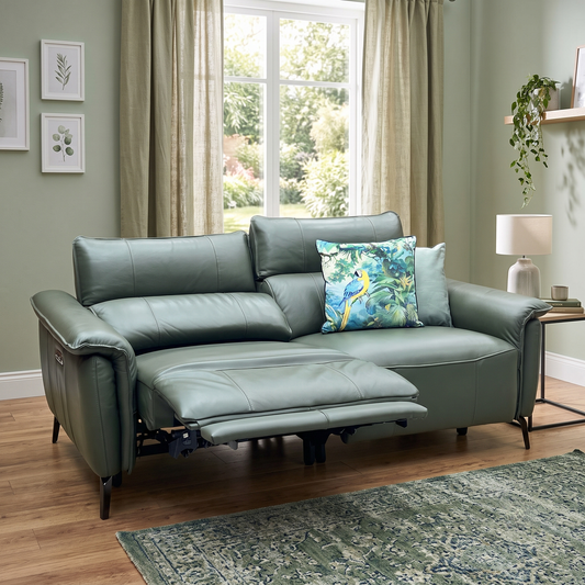 Styled upscale contemporary living room lifestyle layout featuring the Jude peacock green leather smart power recliner sofa arranged as a luxurious, high-tech lounge centerpiece.