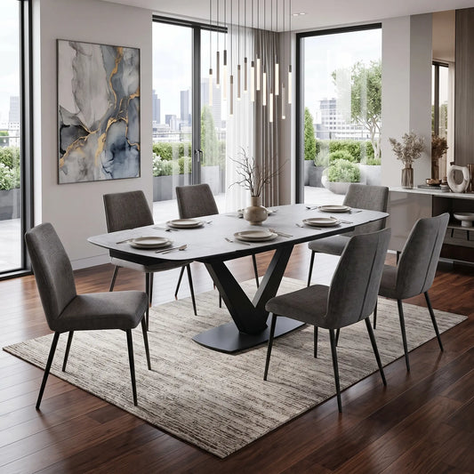 Styled upscale luxury dining room lifestyle layout featuring the Julio silver ceramic extending table arranged beautifully with matching modern velvet-upholstered dining chairs.