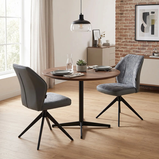 Styled upscale contemporary dining room lifestyle layout featuring the set of 2 Julio anthracite grey fabric chairs beautifully arranged at a modern glass or ceramic-top dining table.