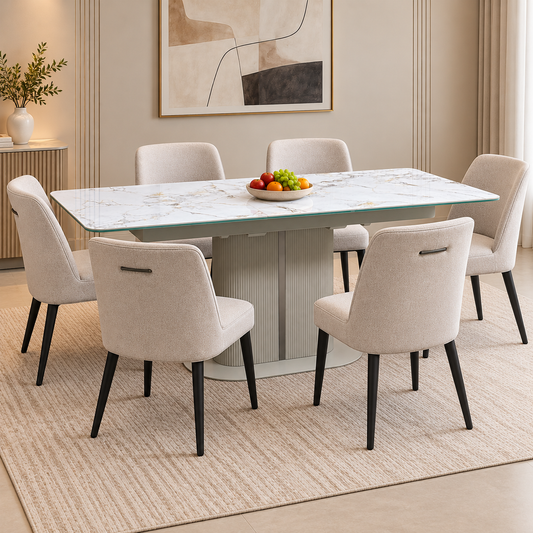 Avorio ceramic top extending dining table in a room scene with six beige fabric chairs and a bowl of fruit