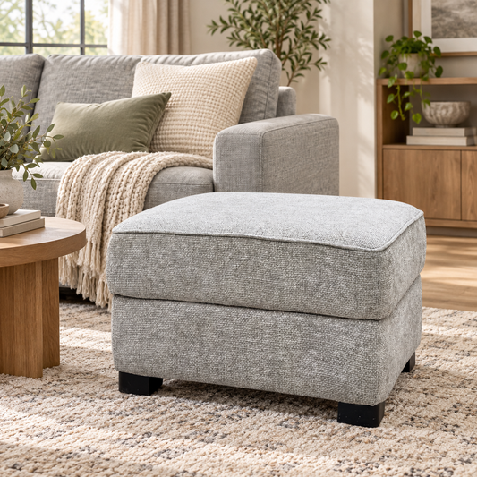Elora mink woven fabric storage footstool in a living room beside a grey sofa and round wooden side table