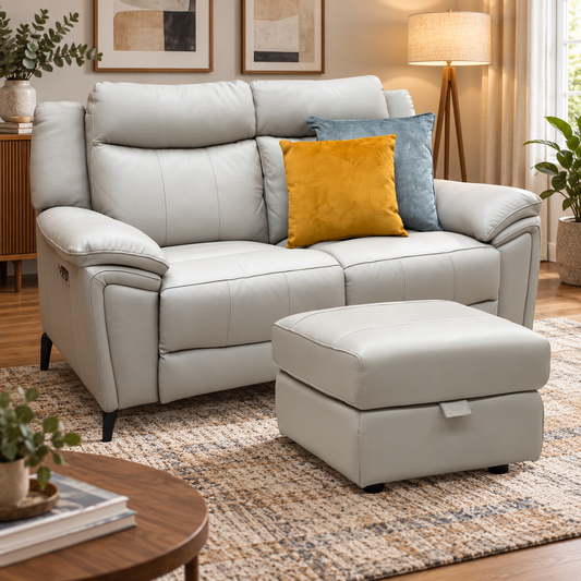 Panache lead grey leather 2 seater power recliner sofa and footstool in a living room with a jute rug
