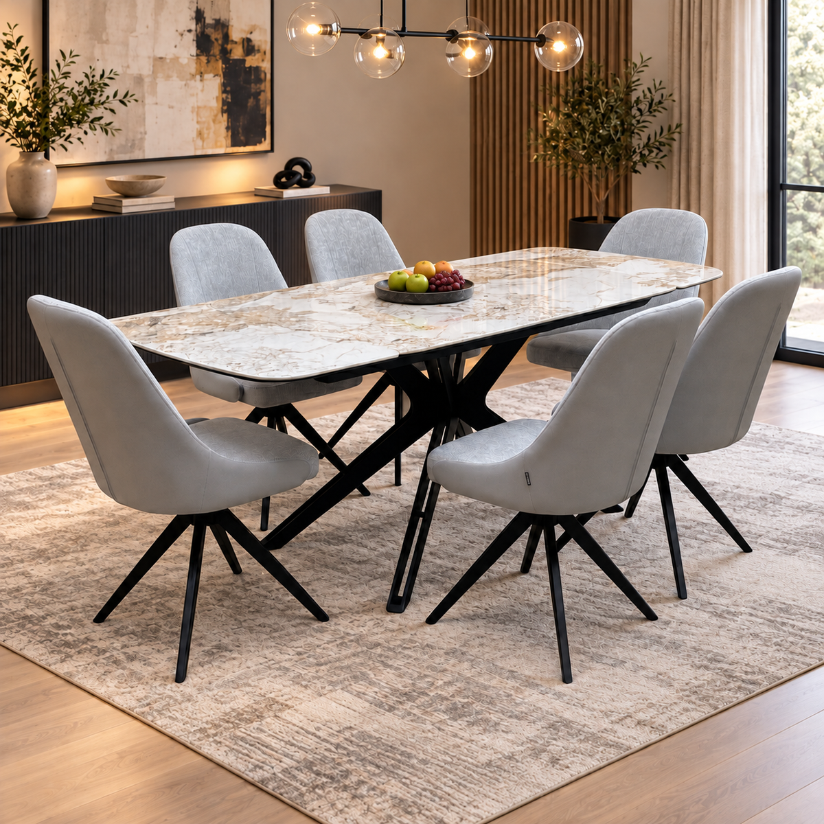 Jose Calcatta marble dining table set with six stone grey swivel chairs in a dining room with a patterned rug
