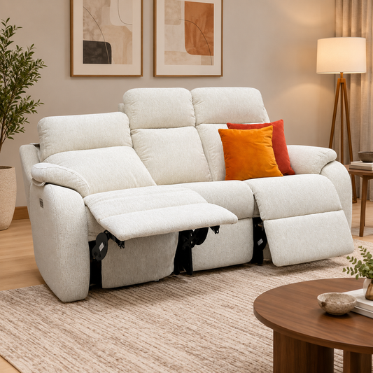 G Plan Kingsbury cream fabric power recliner sofa reclined in a living room with a jute rug and round wooden table