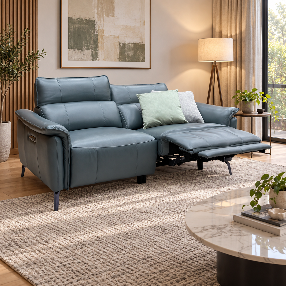 Jude peacock green leather sofa with one seat reclined in a living room on a woven rug