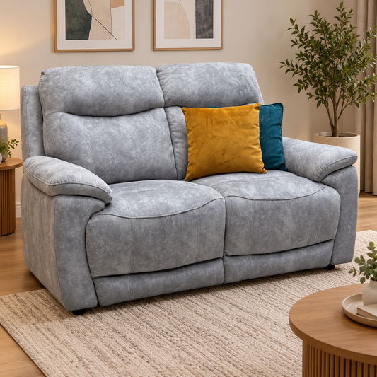 Sloane stone grey velvet 2 seater sofa in a living room with a cream rug and round wooden table
