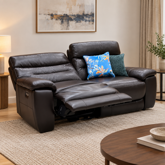 Nimbus dark brown leather 3 seater power recliner sofa reclined in a living room with a round wooden coffee table
