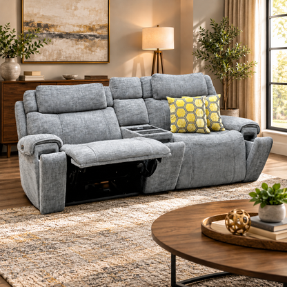Hollywood dove grey fabric media sofa in a living room with left seat reclined, beside a round wooden coffee table