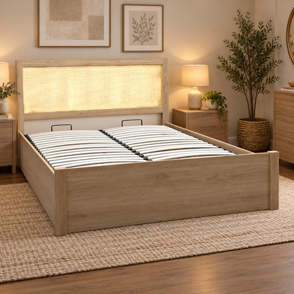 Hamish oak king size ottoman bed with rattan headboard in a bedroom with bedside tables and a jute rug