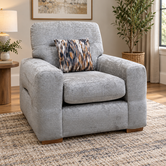 Melrose silver chenille armchair in a living room with a woven rug and side table