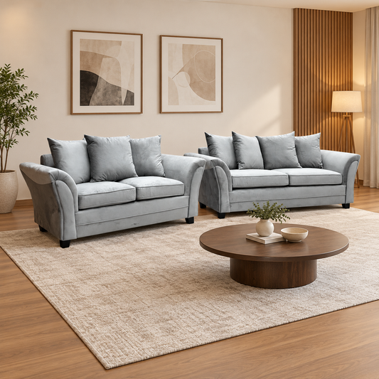 Leila grey velvet 3 + 2 seater scatter back sofa set in a living room with a round wooden coffee table