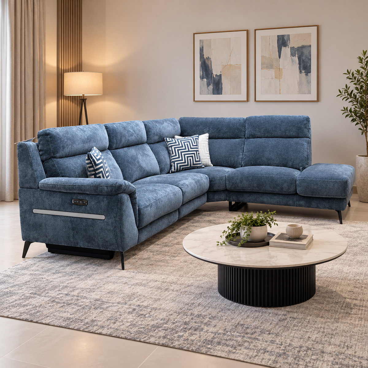 Eclipse silverish blue fabric power recliner corner sofa in a living room with a round marble coffee table