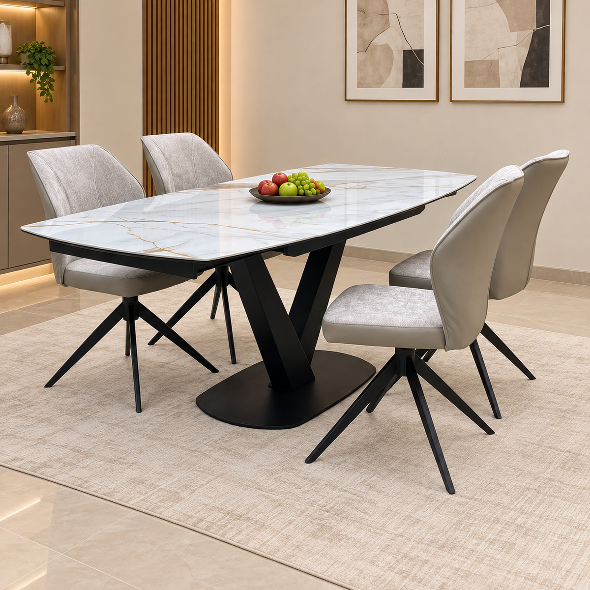Julio marble ceramic extending dining table and four cream swivel chairs in a dining room with a bowl of fruit