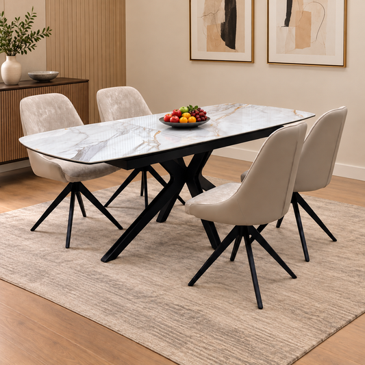 Jose Fiorentino marble ceramic dining table and four chairs in a room with a fruit bowl on a beige rug