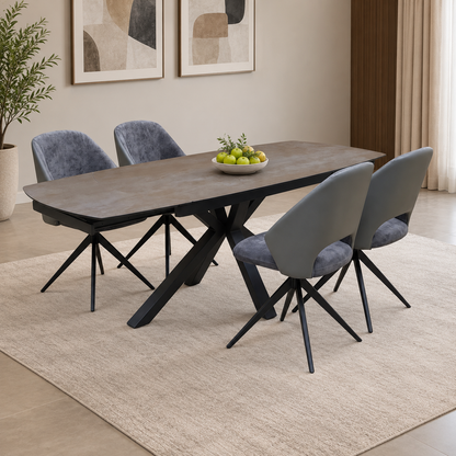 Raul grey ceramic extending dining table and 4 swivel chairs in a dining room with a cream rug and fruit bowl