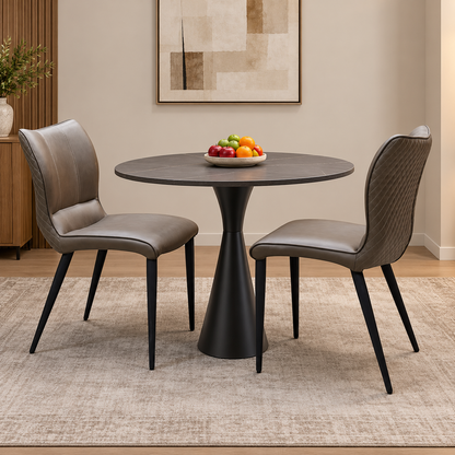 Murcia antiqued olive green dining chairs either side of a round dark wood pedestal table in a dining room