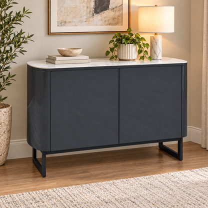 Carrera ceramic top small sideboard in a living room with a lamp, plant and books on top
