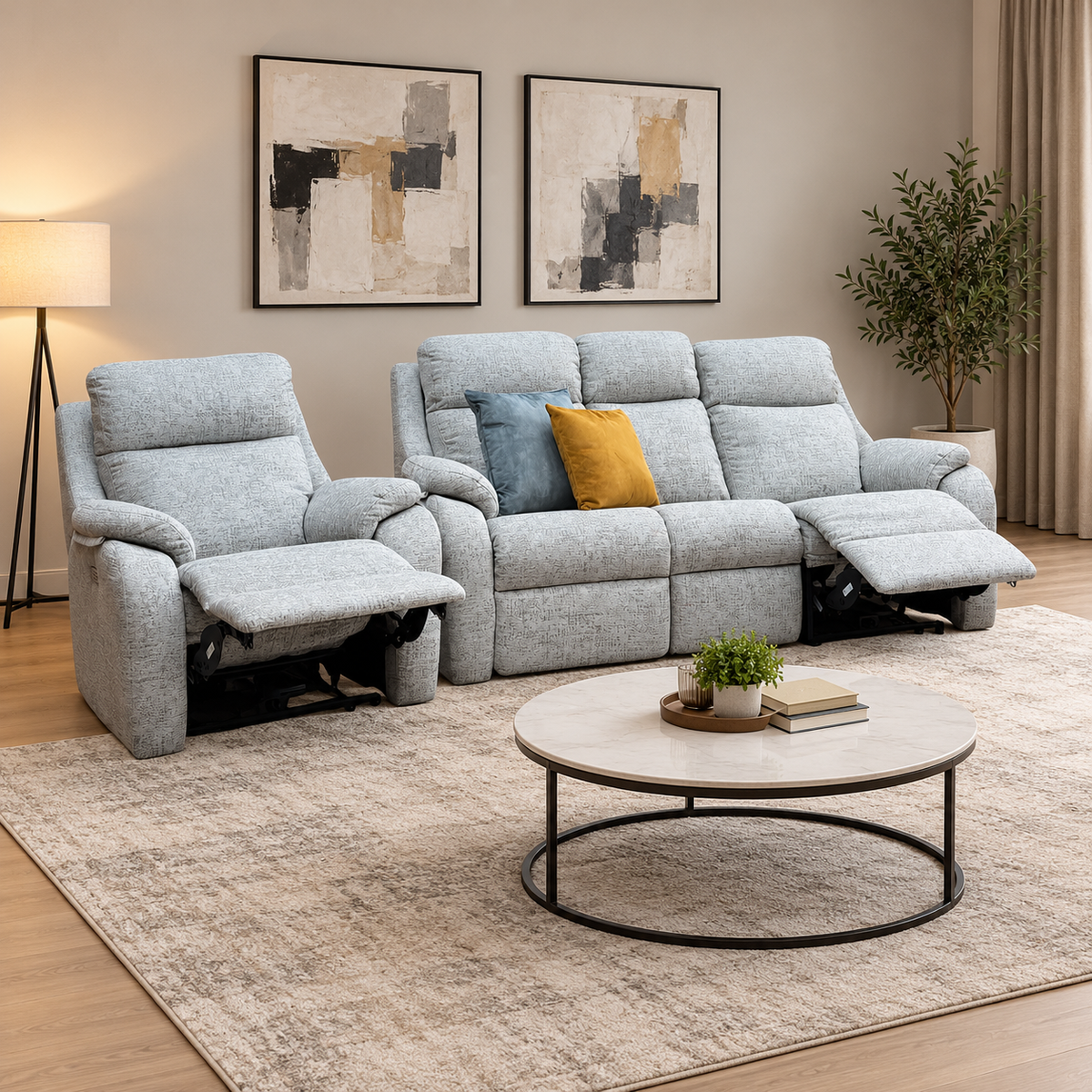 G Plan Kingsbury mist grey 3 seater sofa and chair reclined in a living room with a round marble coffee table