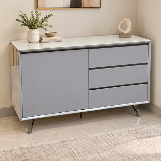 Mirage neutral ceramic top sideboard in a living room with a plant, vase and framed print