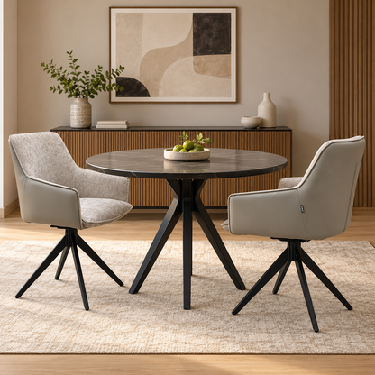 Pair of Jose cream fabric swivel dining chairs at a round black dining table in a room scene
