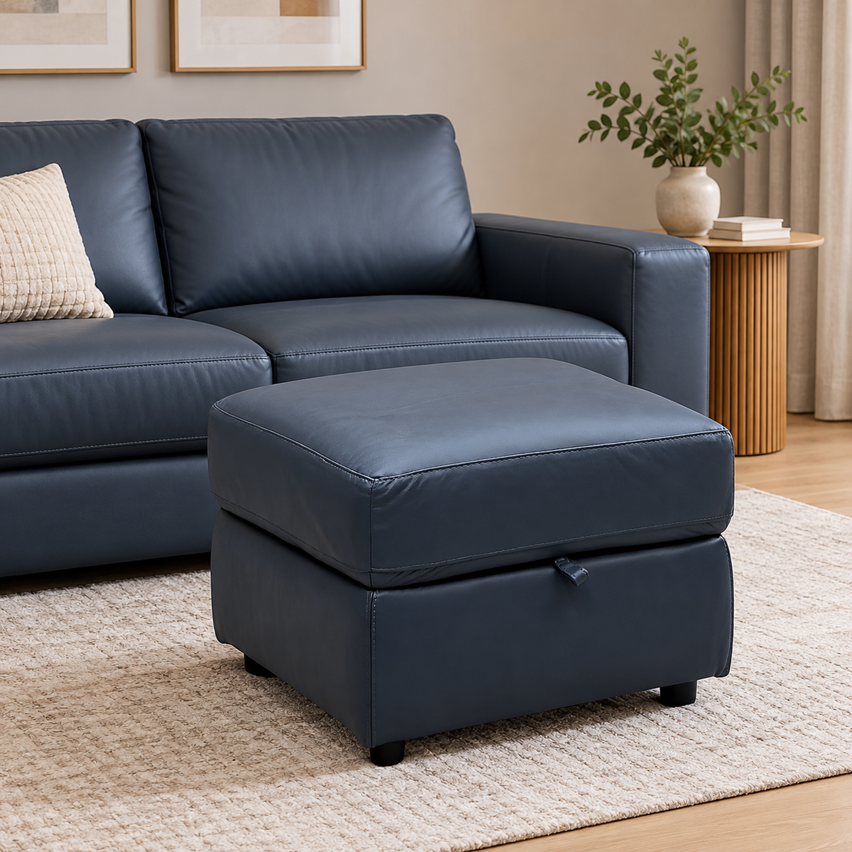 World of Leather Touch ocean blue leather storage footstool in a living room beside a matching blue sofa