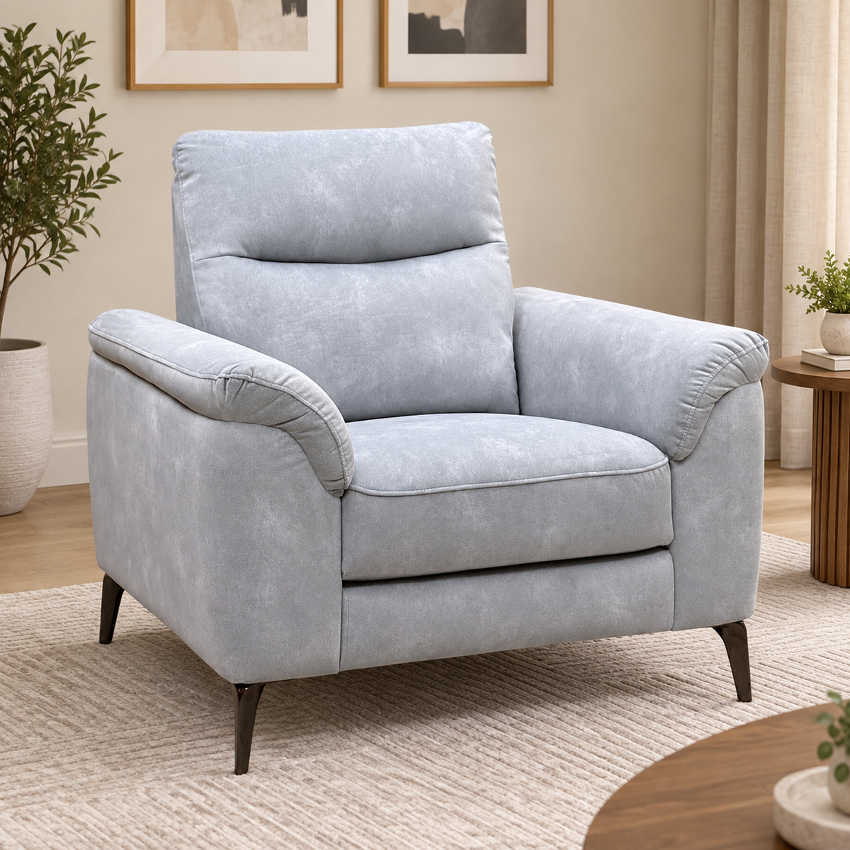 Morgan smoke grey velvet chair in a living room on a cream rug beside an olive tree