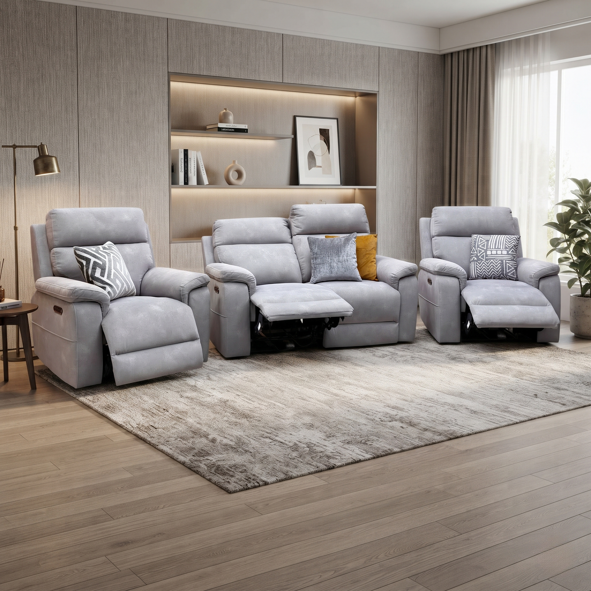 Raven stone grey velvet power recliner sofa and two power chairs reclined in a living room with a grey rug