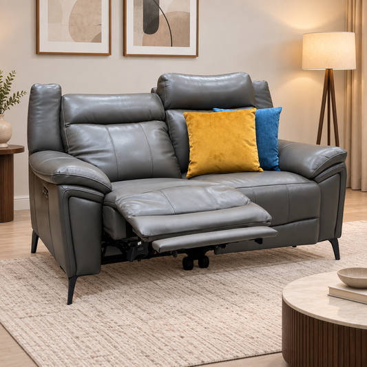Panache storm grey leather 2 seater power recliner sofa in a living room with one seat reclined on a cream rug