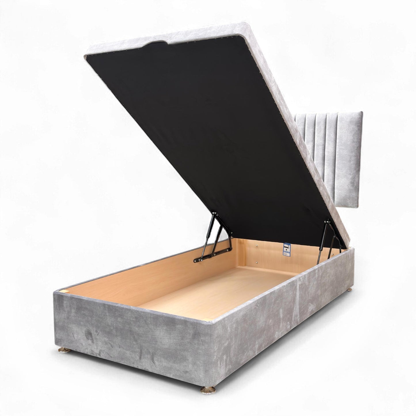 View of the Nero single bed, showcasing the shimmering dolphin grey velvet and the deep ottoman storage base.