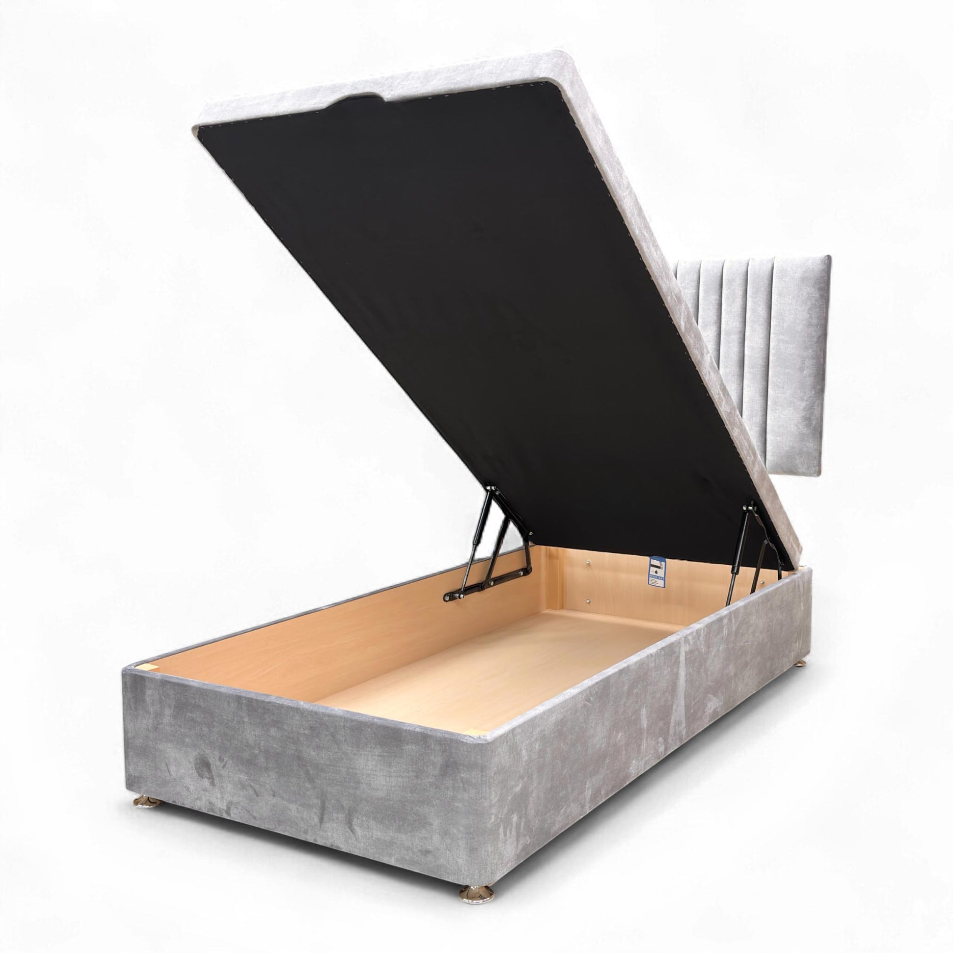 View of the Nero single bed, showcasing the shimmering dolphin grey velvet and the deep ottoman storage base.
