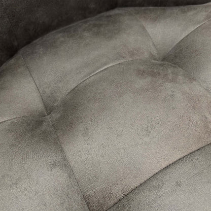Detailed shot of the premium charcoal grey suede upholstery and soft-touch textured finish.