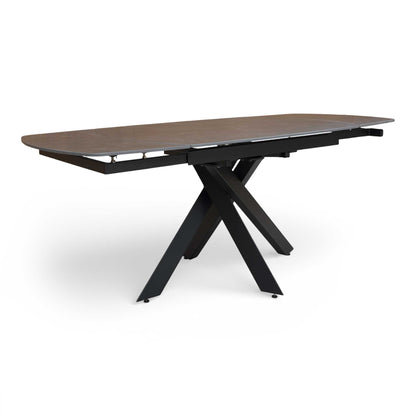 Full view of the ‘Warrior’ Grey Sintered Stone Swivel Extending Dining Table in its closed position.
