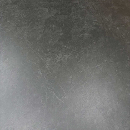 Close-up of the durable grey sintered stone tabletop surface with scratch-resistant industrial detail.