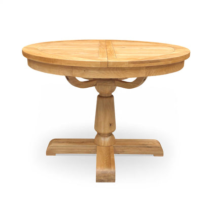 Side view of the Augusta dining table's central pedestal leg structure, showcasing the craftsmanship, stability, and elegant turned wood design.