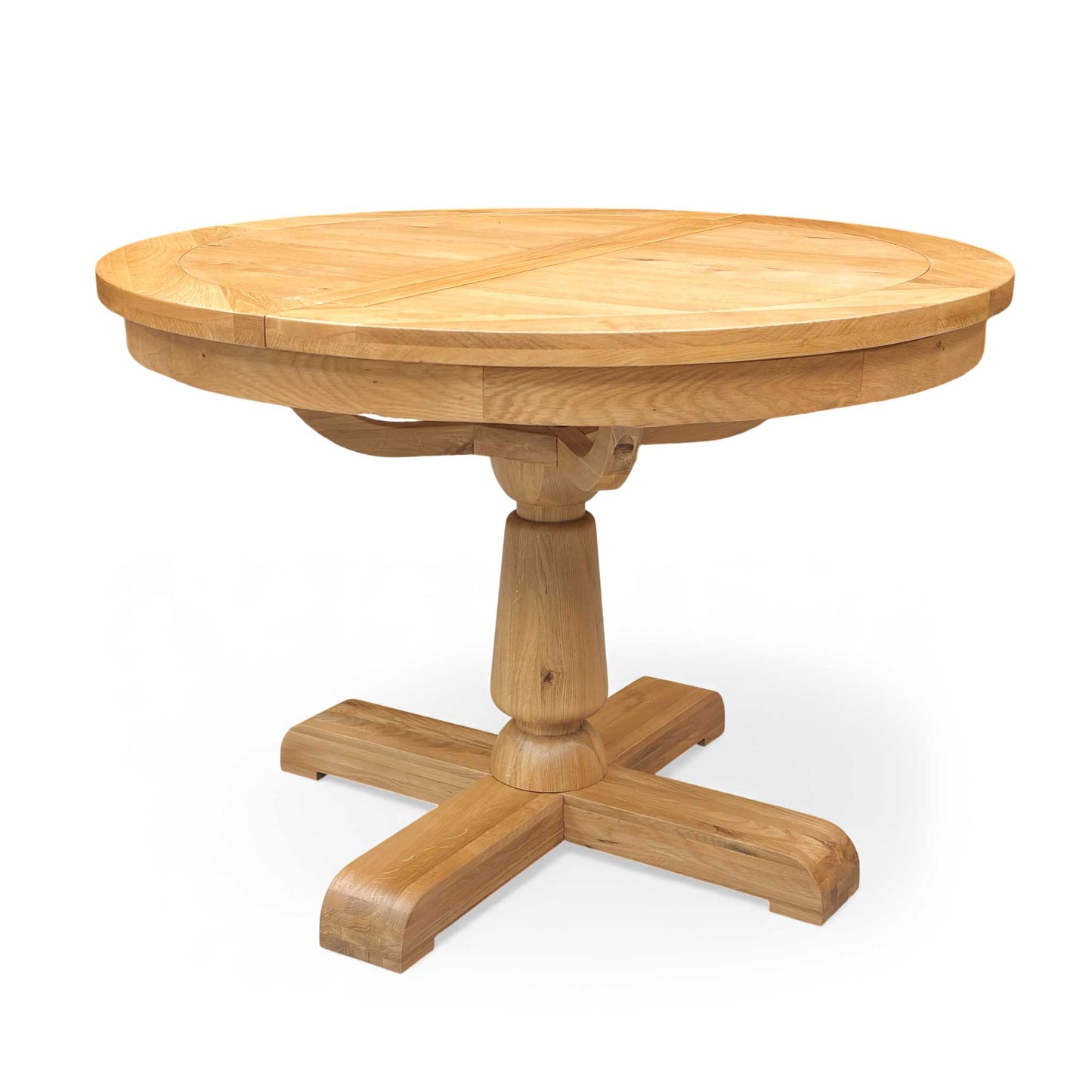 Side view of the Furnitureland Augusta round extending dining table, showcasing its natural wood grain tabletop, rustic finish, and sturdy central pedestal base.