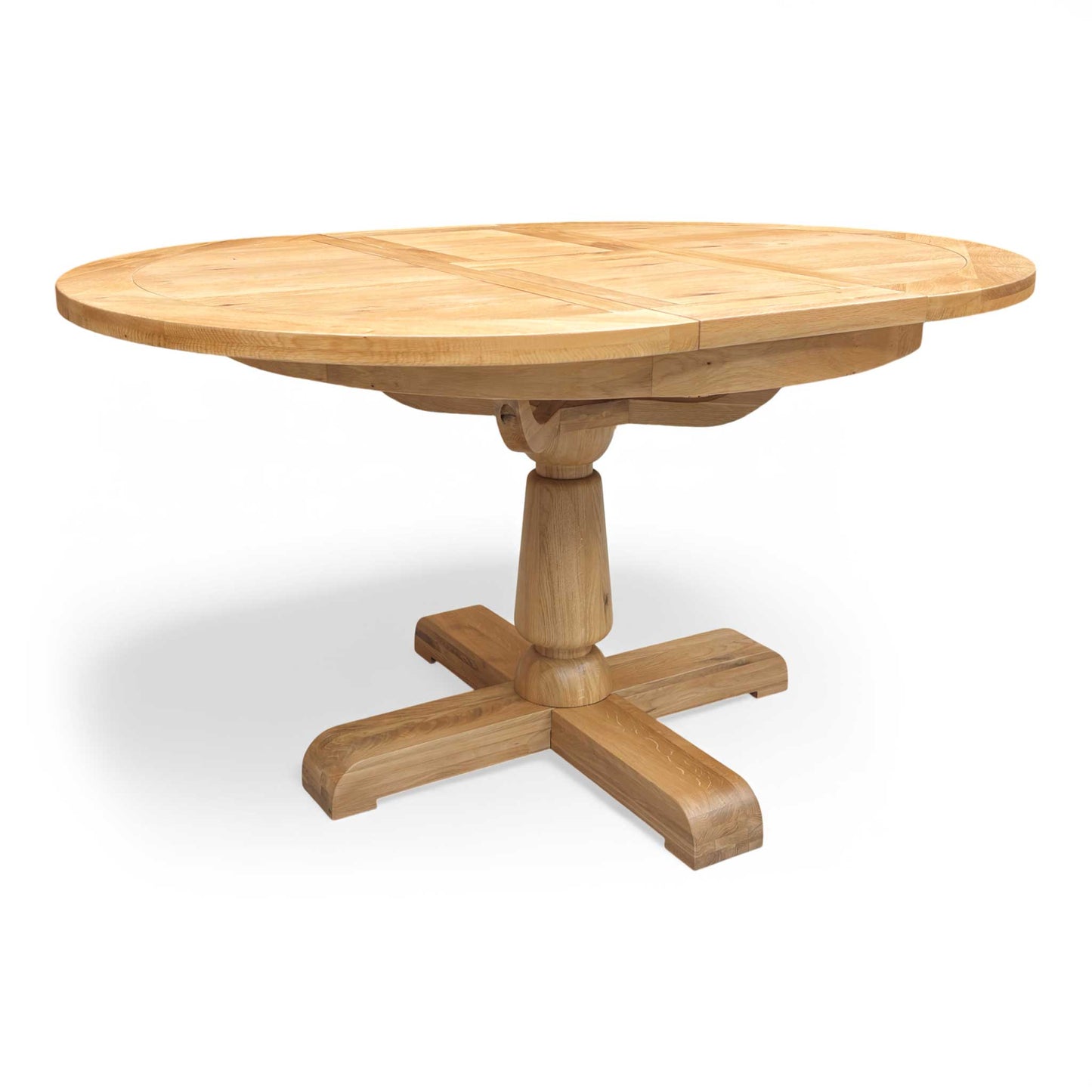Full view of the Furnitureland Augusta round extending dining table, showcasing its natural wood grain tabletop, rustic finish, and sturdy central pedestal base.