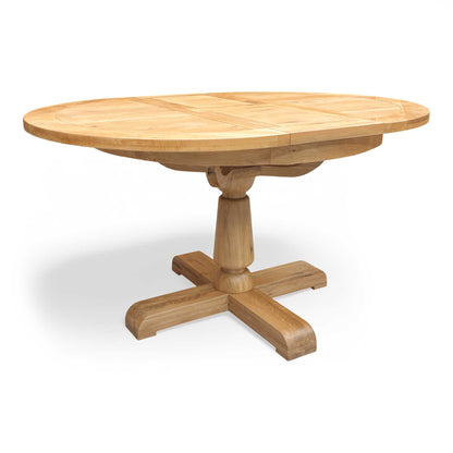 Full view of the Furnitureland Augusta round extending dining table, showcasing its natural wood grain tabletop, rustic finish, and sturdy central pedestal base.