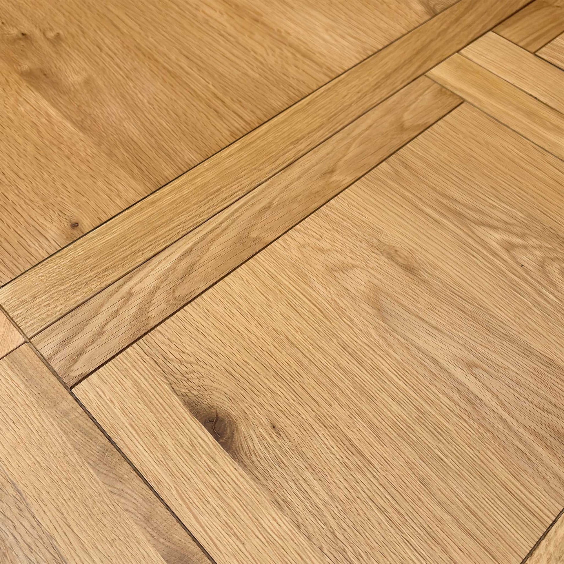 Macro view of the Augusta dining table surface, highlighting the high-quality rustic wood grain texture, durable protective finish, and natural timber tones.