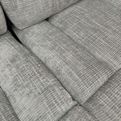 Close-up of the seating area on the ‘Wilbur’ sofa, detailing the grey fabric texture and durable stitching.