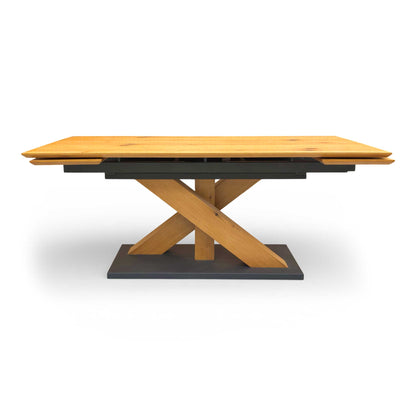 The Aydin table shown in its fully extended position, illustrating how the extra leaves perfectly match the oak patterning to seat up to 10 guests.
