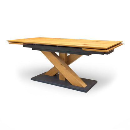 Detail shot of the oak veneer table top, emphasizing the unique natural marks, knots, and warm texture of the wood.